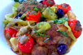 Mediterranean-Style Braised Chicken Topped with Sausage Stuffed Cherry Peppers 